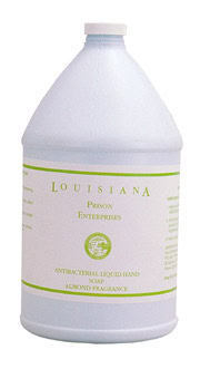 A large white gallon bottle labeled “Louisiana Prison Enterprises Antibacterial Liquid Hand Soap Almond Fragrance.”.