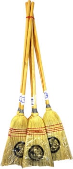 Four lightweight brooms with wooden handles stand upright, grouped and wrapped in clear plastic at the base.