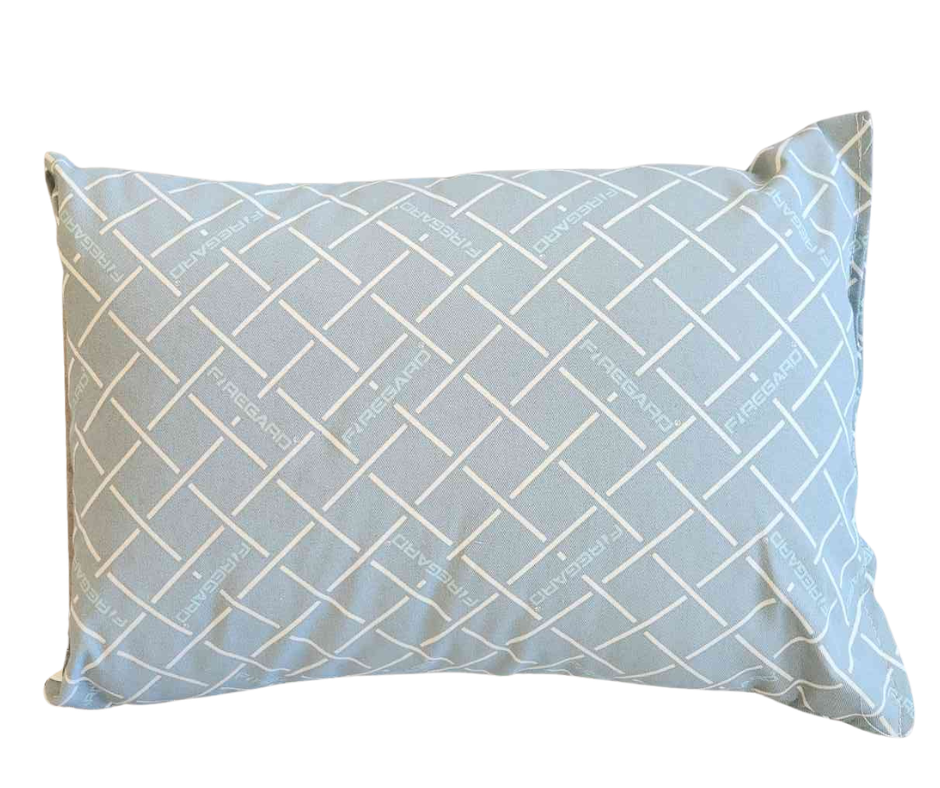 Poly Foam Pillow Wrapped in Blue Fire Guard with a blue, grid-patterned cover and “FIREGUARD” printed on it.