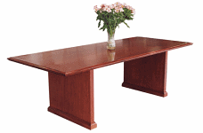 An 8x42x30 Conference Table with a vase of pink flowers placed at the center.