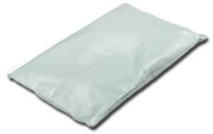 A Pillow Cotton Staphchek sealed in a light gray plastic mailing envelope lies flat on a white surface.