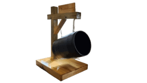 The Hanging Trash Receptacle is a black metal barrel suspended by chains from a wooden frame on a wooden base.