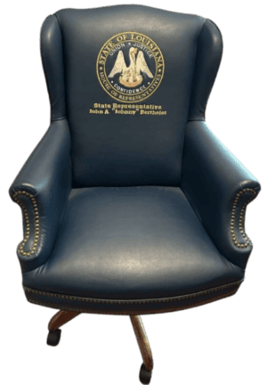 XL Adjustable Executive Wingback Chair in blue leather with brass nailhead trim, Louisiana state seal, and State Rep. John A. Berthelot text.