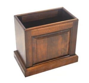 The Mahogany Trash Can 17x10x17 features a decorative front and wide base, displayed on a plain white background.