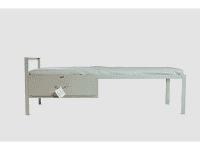 The Single Bed Frame Steel features a thin mattress, an underbed drawer, and a tag on the drawer handle.