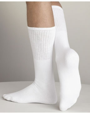 Someone wears Tube Socks White 80/20, one foot flat and the other raised to show the sole and heel.